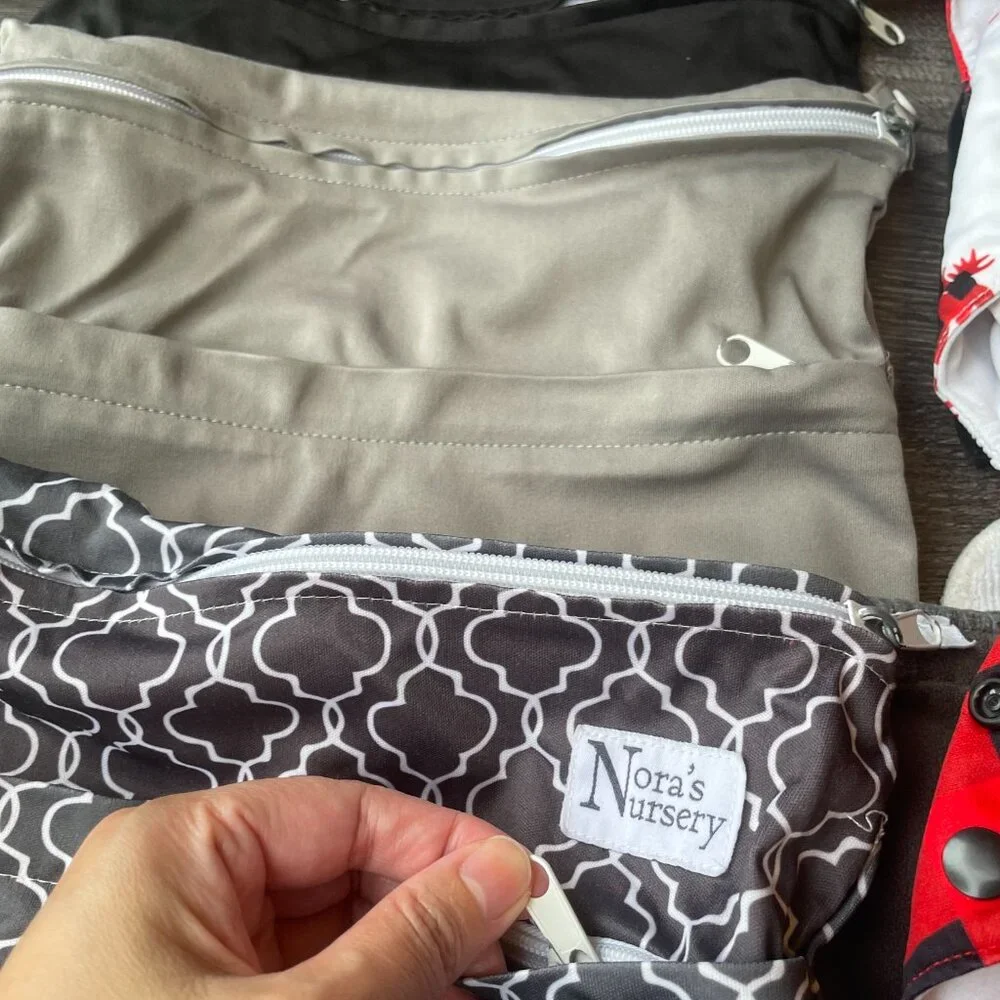 REUSABLE/ ADJUSTABLE BABY DIAPERS: 9 Cloth Diapers And 3 Diaper Bag